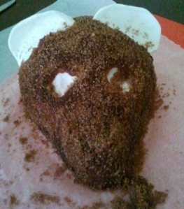 I covered the bear in a dark coloured icing and sugar which I coloured brown. 